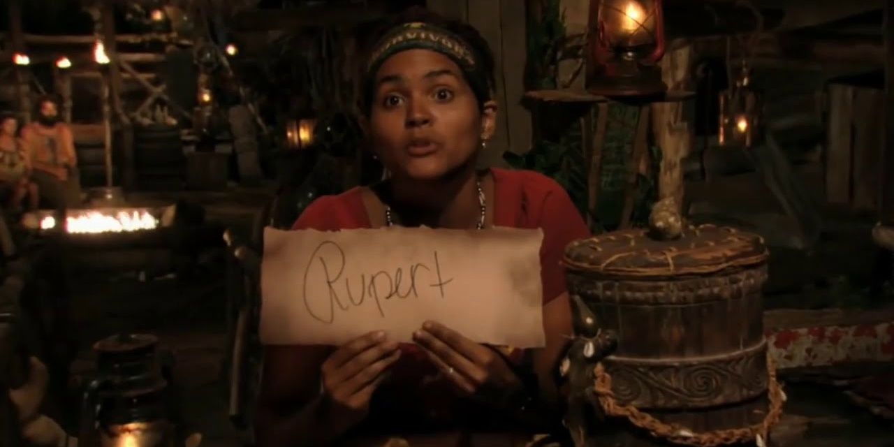 Sandra holding a piece of paper that says &quot;Rupert.&quot;
