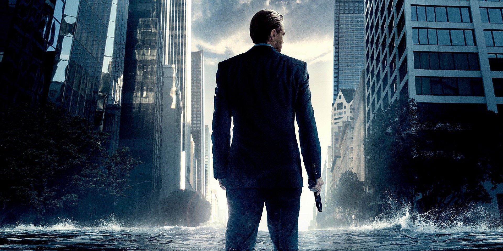 Crop of the Inception poster of Dom standing in a flooded street holding a gun