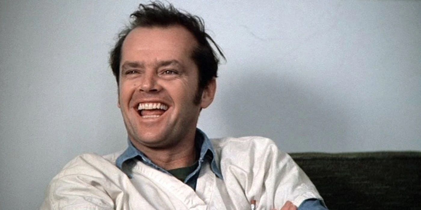 Randle McMurphy (Jack Nicholson) laughs in the doctor's office in One Flew Over the Cuckoo's Nest.