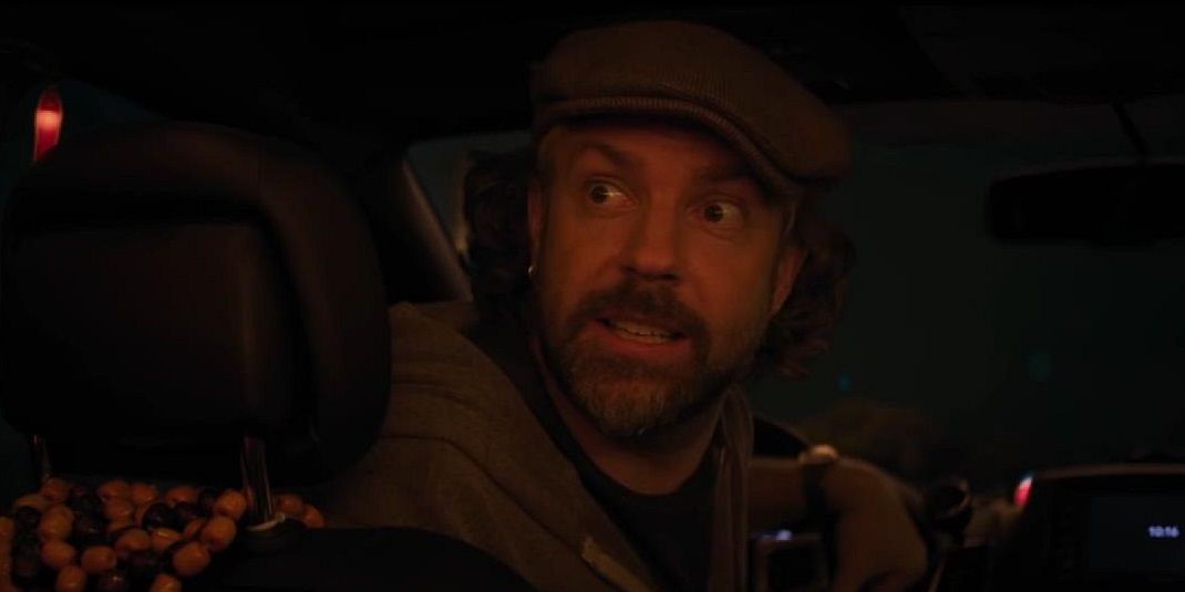 Jason Sudeikis driving a car in a still from Booksmart