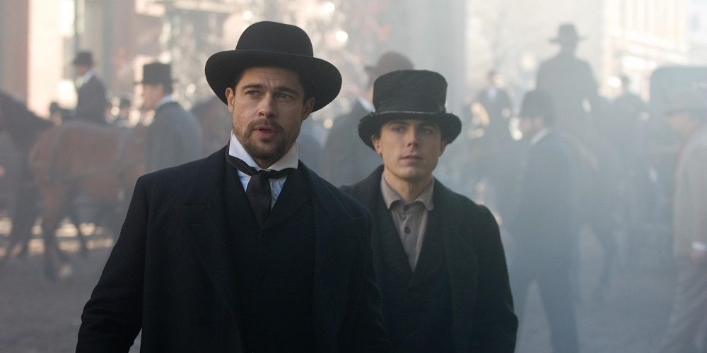 Brad Pitt and Casey Affleck looking at something in The Assassination of Jesse James by the Coward Robert Ford