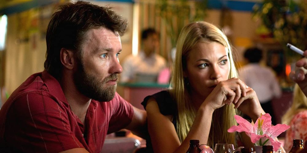 A close-up of Joel Edgerton's character Baz eating dinner at a restaurant in Animal Kingdom