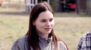 Julia Trubkina In 90 Day Fiance in grey sweatshirt talking to Brandon outside farm