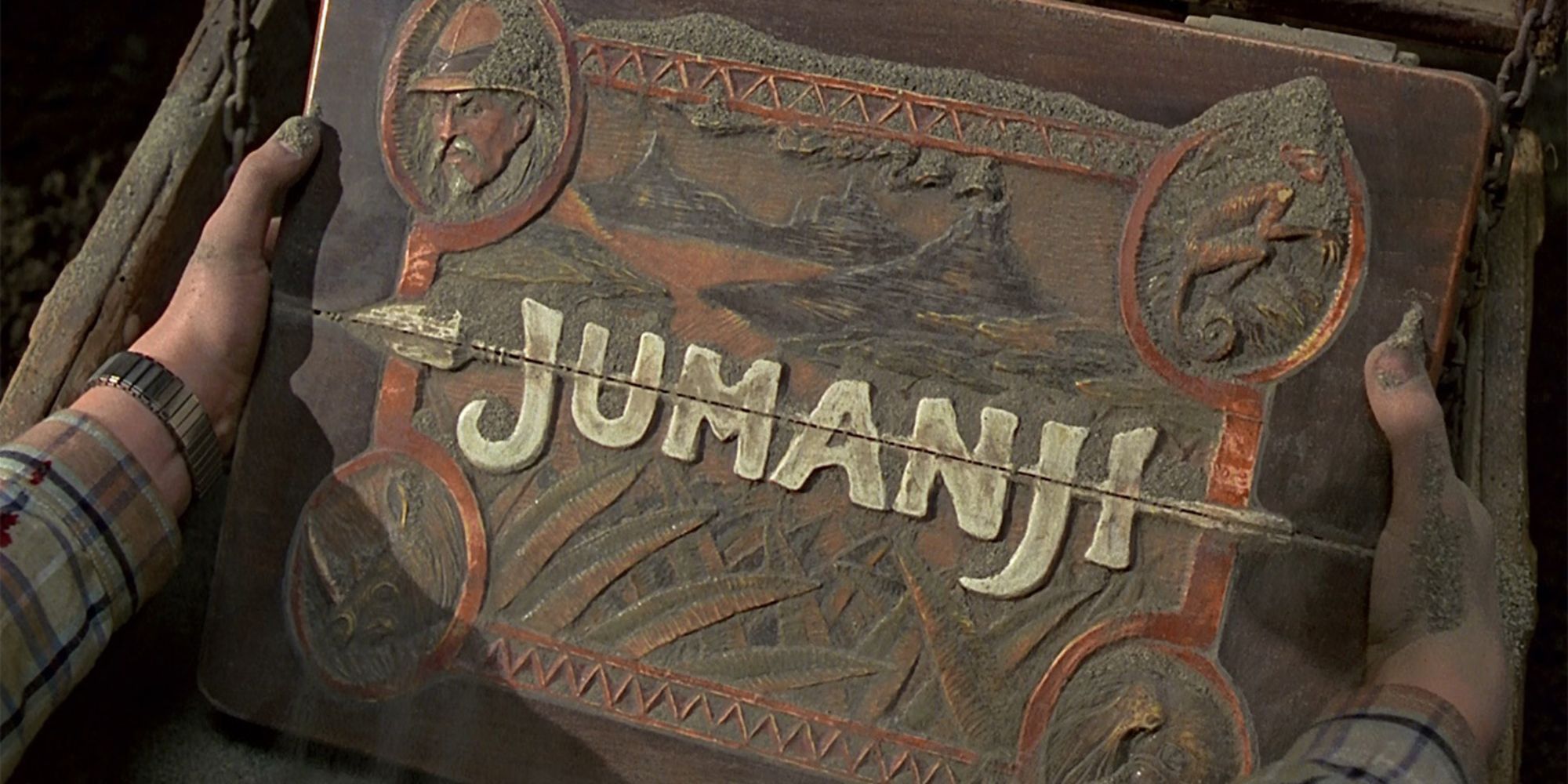 Alan Parrish finding the Jumanji board game in a chest in Jumanji (1995)