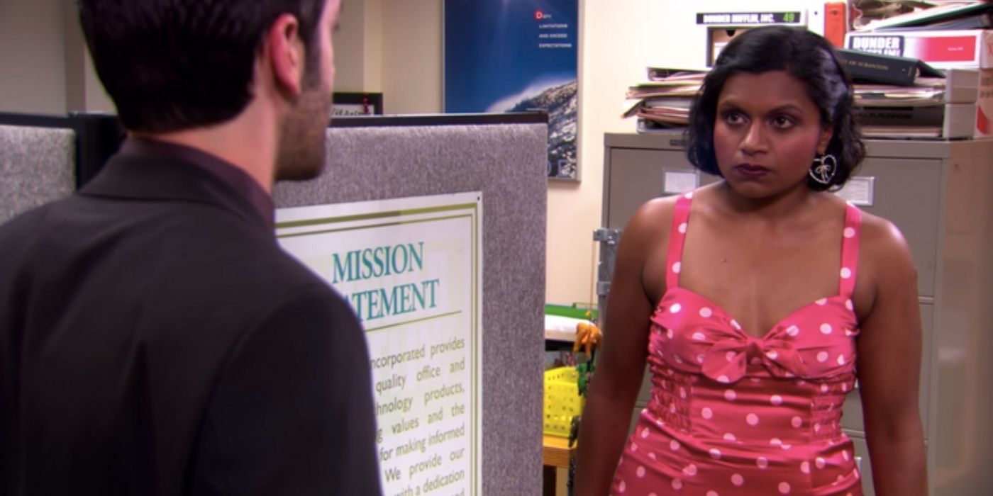 Kelly talking to Ryan on The Office and looking angry.