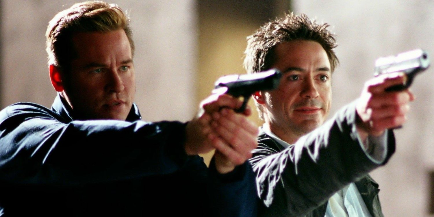 Val Kilmer and Robert Downey Jr. pointing guns in Kiss Kiss Bang Bang