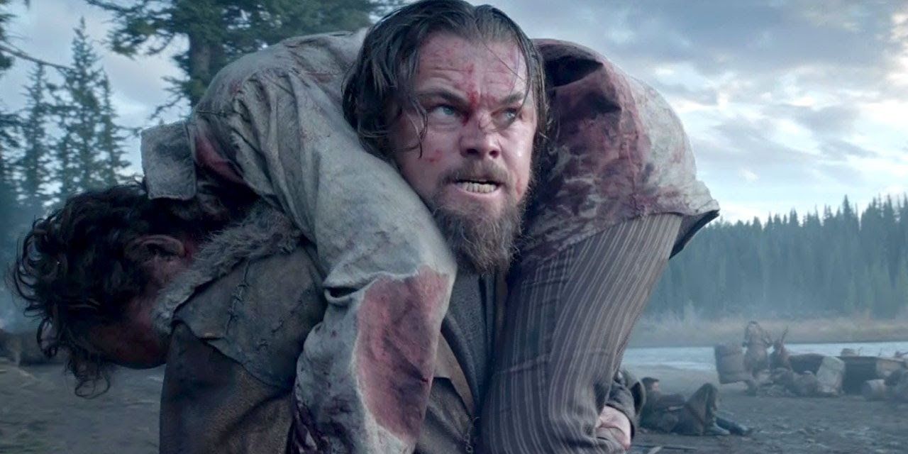 Leonardo DiCaprio as Hugh Glass carrying his son in The Revenant Cropped