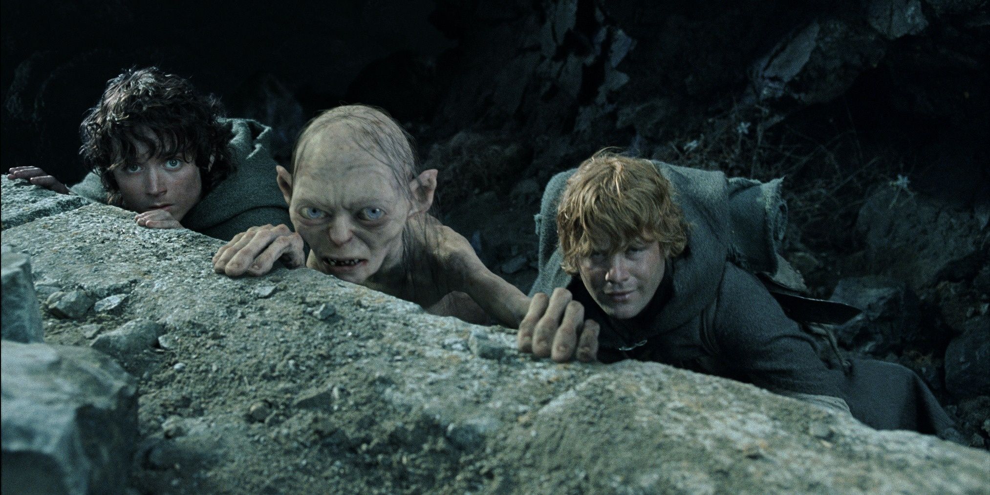 Frodo, Gollum and Sam looking on