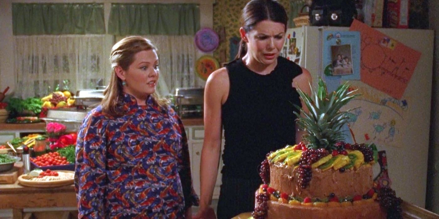 Sookie and Lorelai staring at a cake on Gilmore Girls