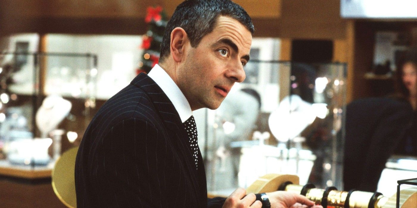 Rowan Atkinson gift wrapping a present in Love Actually.
