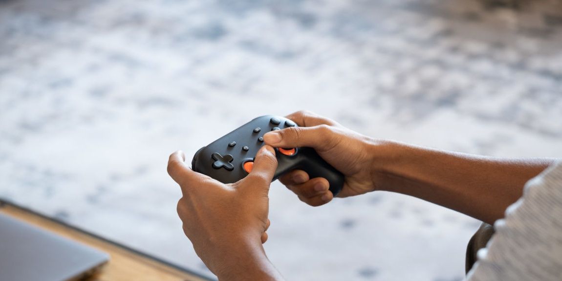 A man using the Google Stadia controller