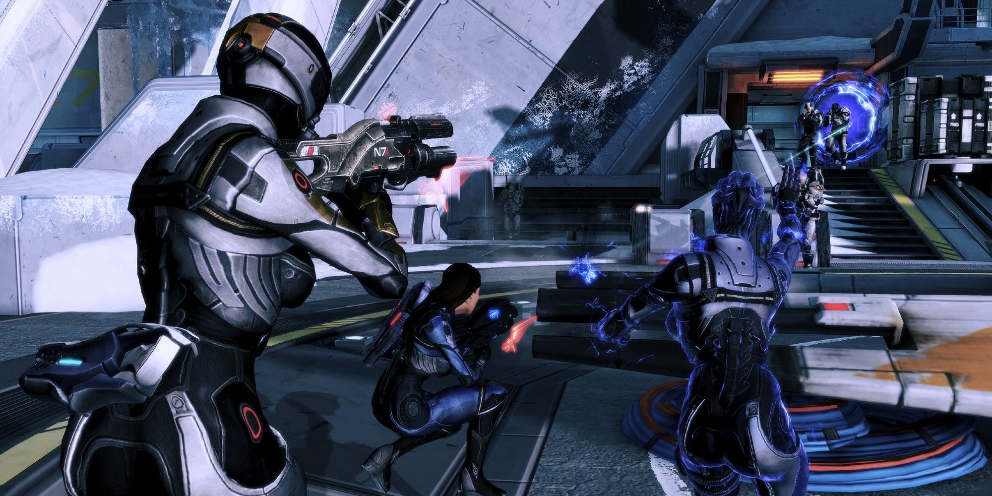 Shepard, Ashley, and Liara fight from cover in Mass Effect 3