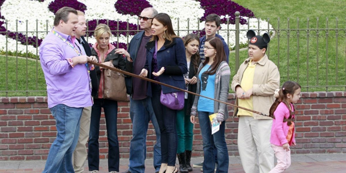 Modern Family cast at the entrance of Disneyland. 