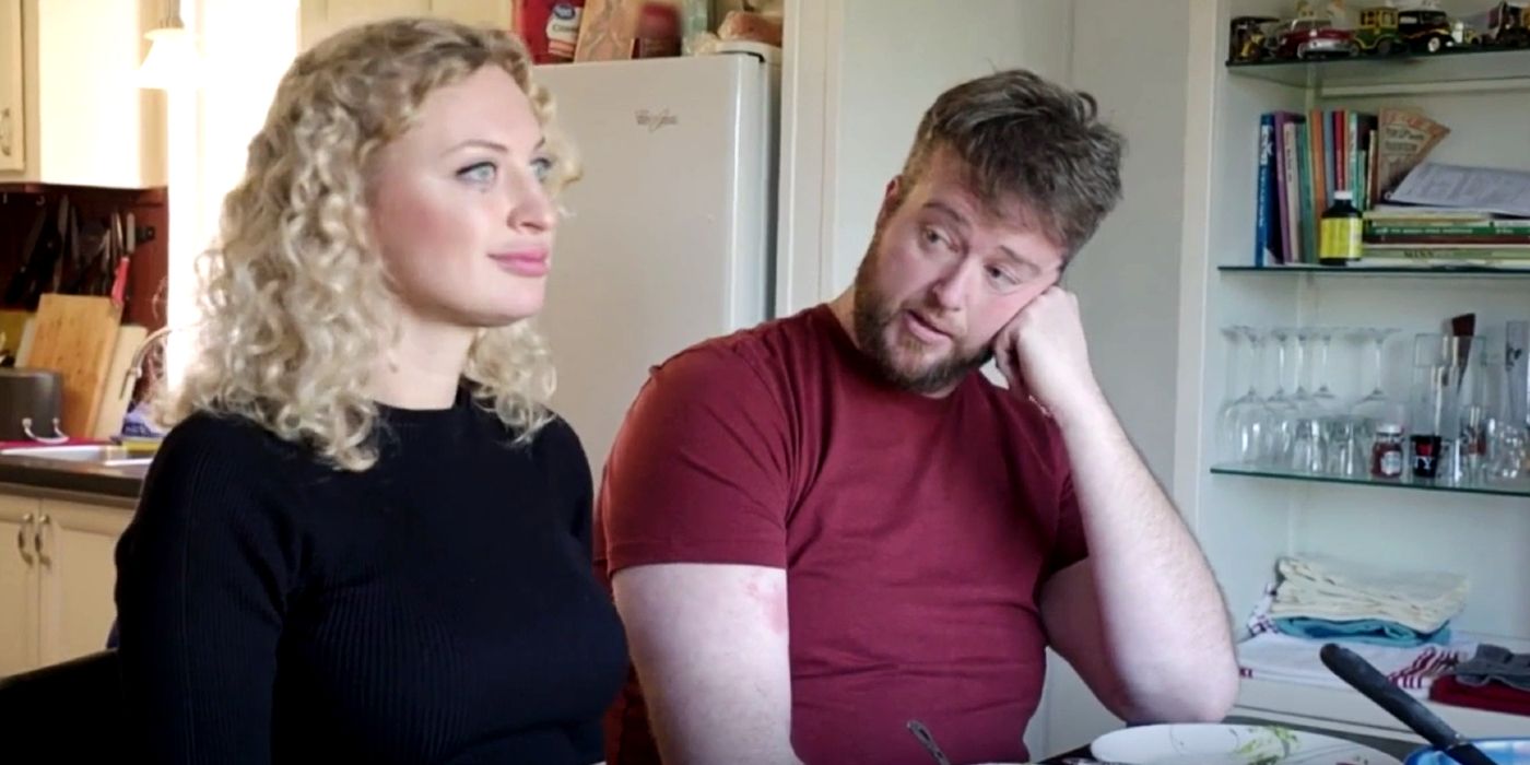 Natalie Mordovtseva And Mike Youngquist In 90 Day Fiance 7 sitting at a table togther