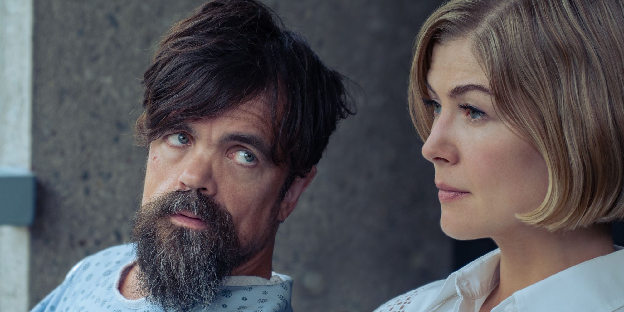 Peter Dinkalge sits next to Rosamund Pike and talks to her