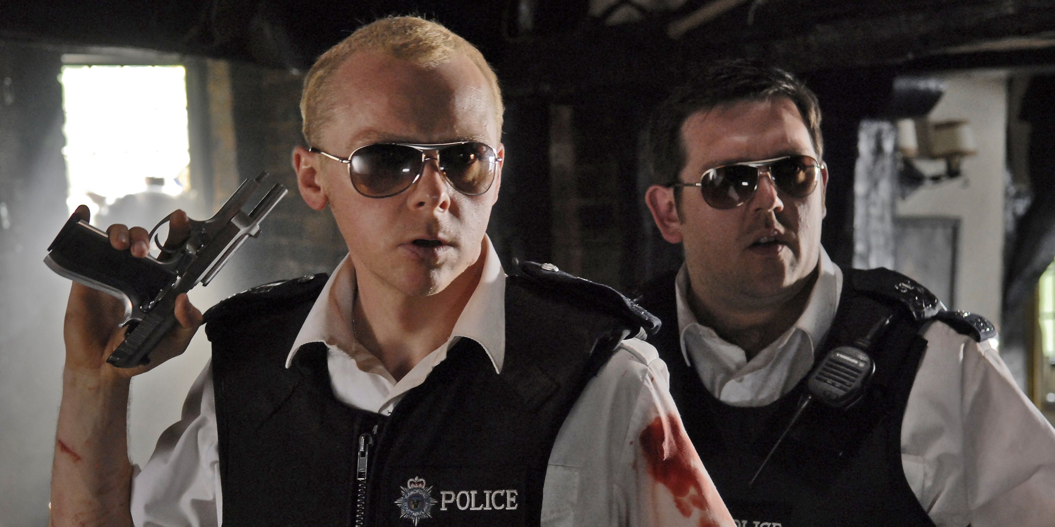 Nicholas and Danny with guns in the pub in Hot Fuzz