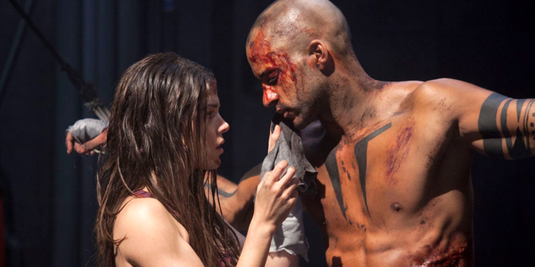 Octavia helps Lincoln after he is tortured in The 100