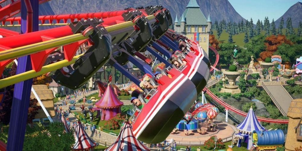 Players ride a roller coaster in Planet Coaster