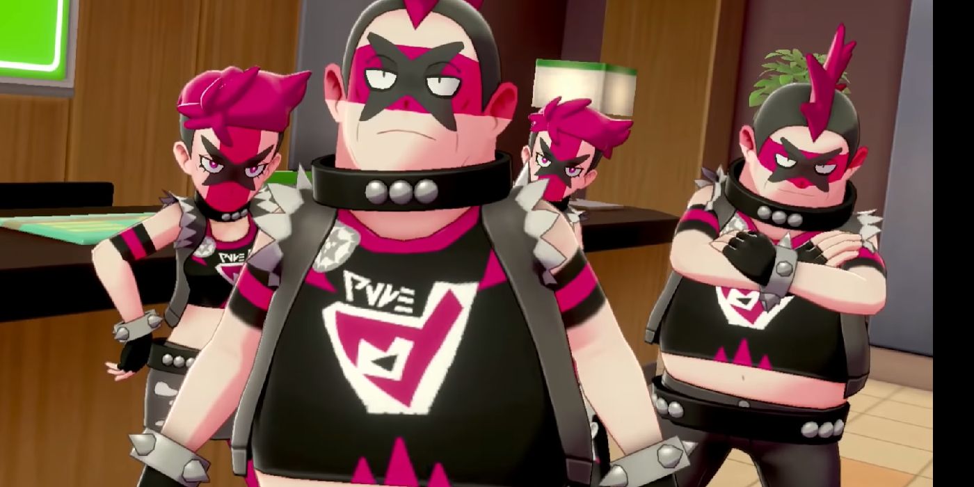 A group of Team Yell grunts in black and pink outfits in Pokémon Sword &amp; Shield.