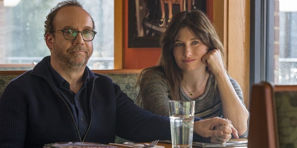 Paul Giamatti and Kathryn Hahn sitting in a motel in a still from Private life