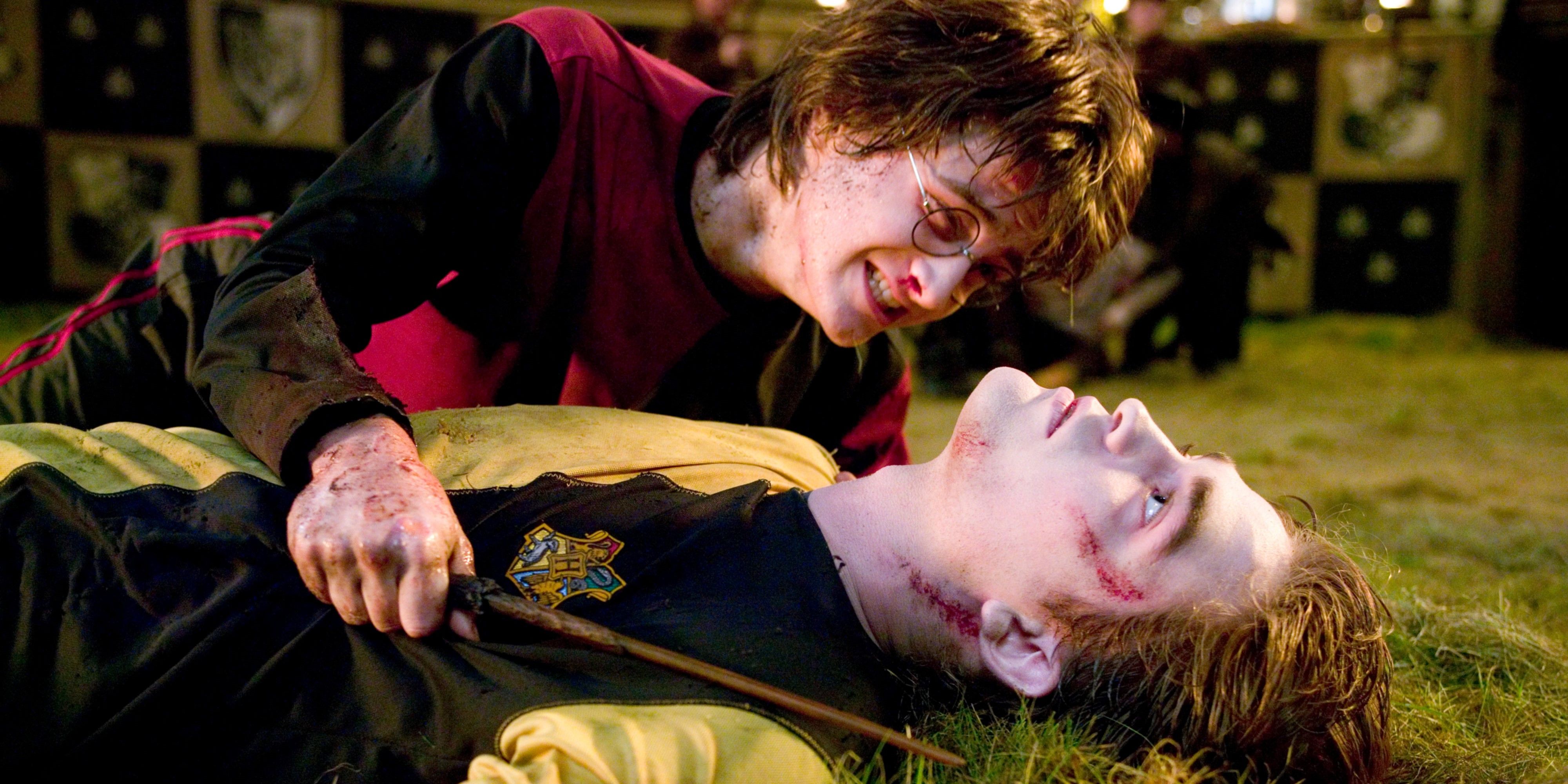 Harry holds onto Cedric's body in The Goblet of Fire.