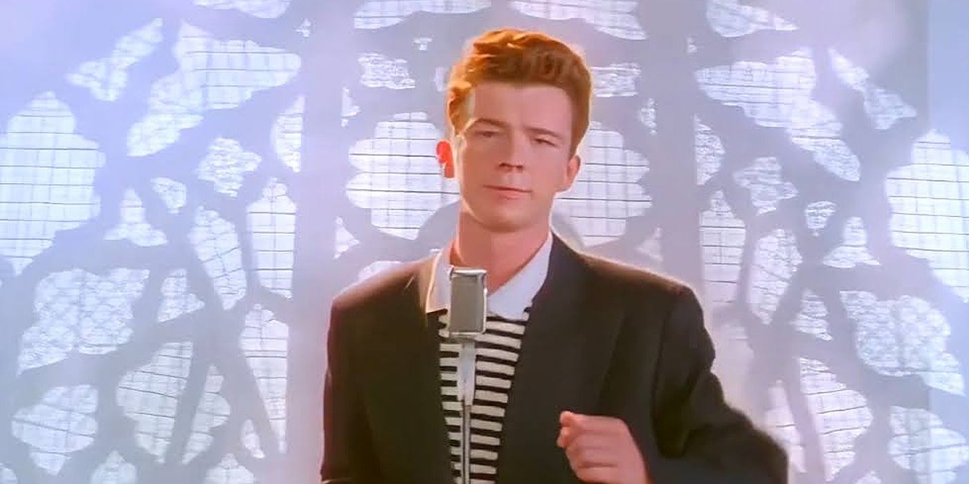 Rick Astley dancing in front of his stand-up microphone in the Never Gonna Give You Up music video.