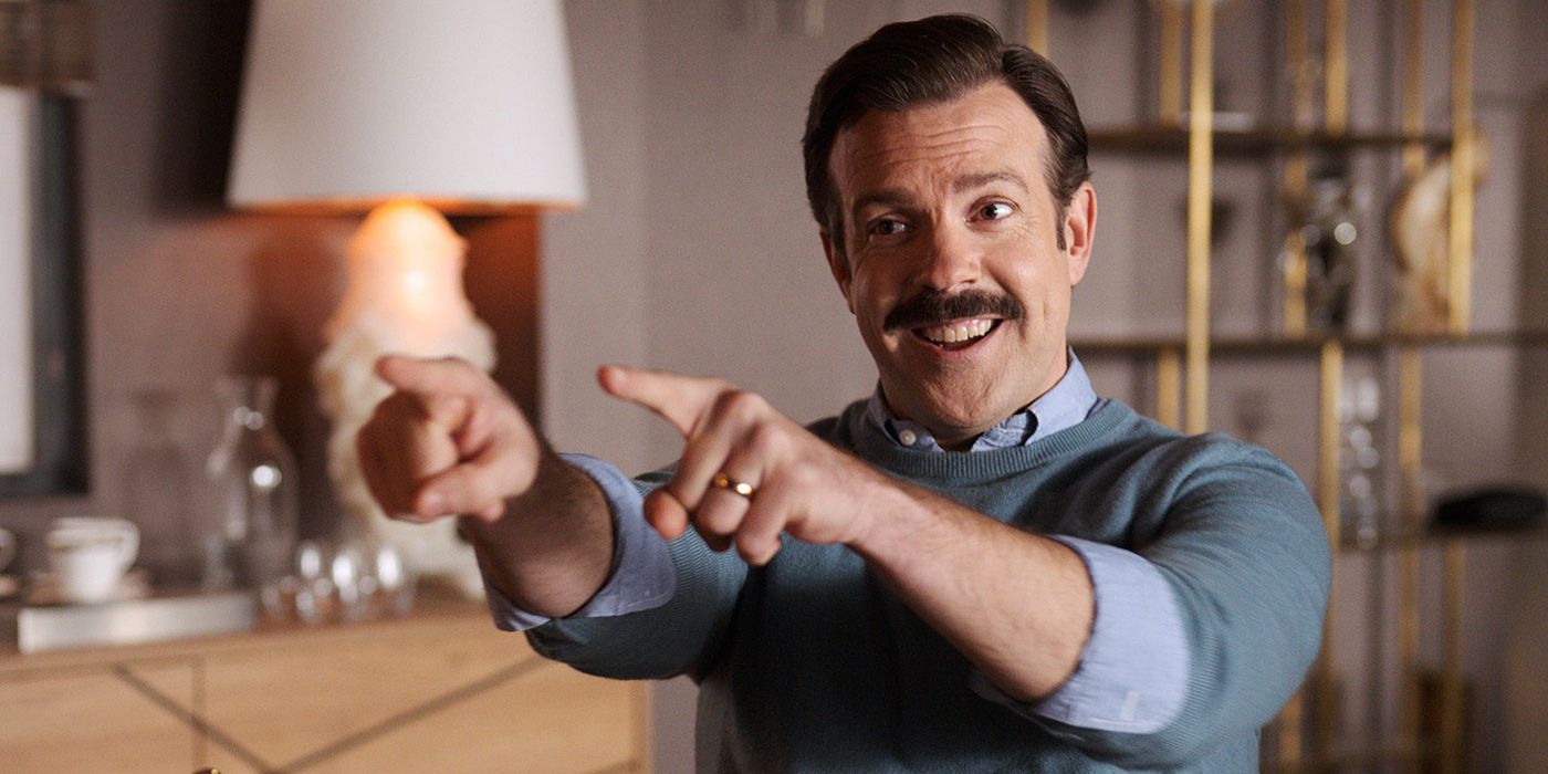 Ted Lasso points both his fingers at someone in Ted Lasso.