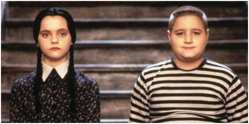The Addams Family girl with braids and boy in striped shirt