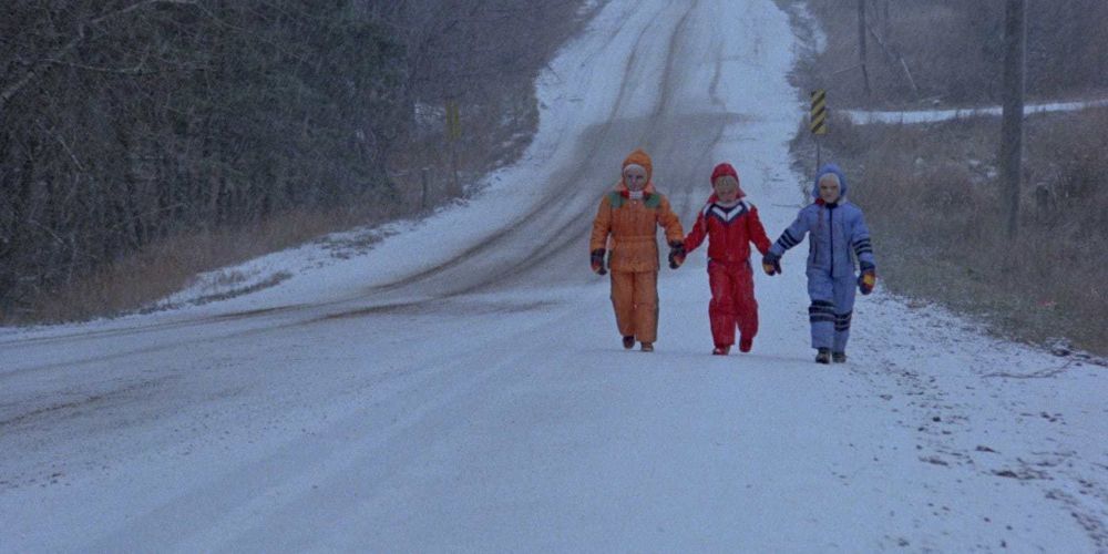 Nola's mutant children walking on a snowy road in The Brood