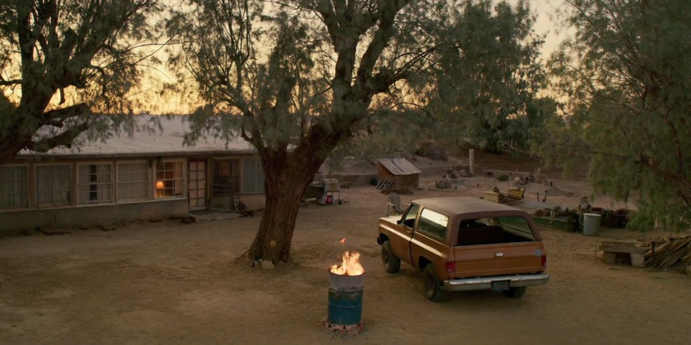 Deacon's truck next to a barrel on fire in The Little Things