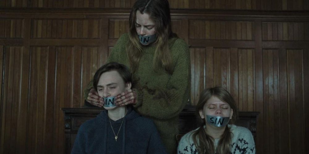 The trio have tape over their mouths as they are held captive in The Lodge