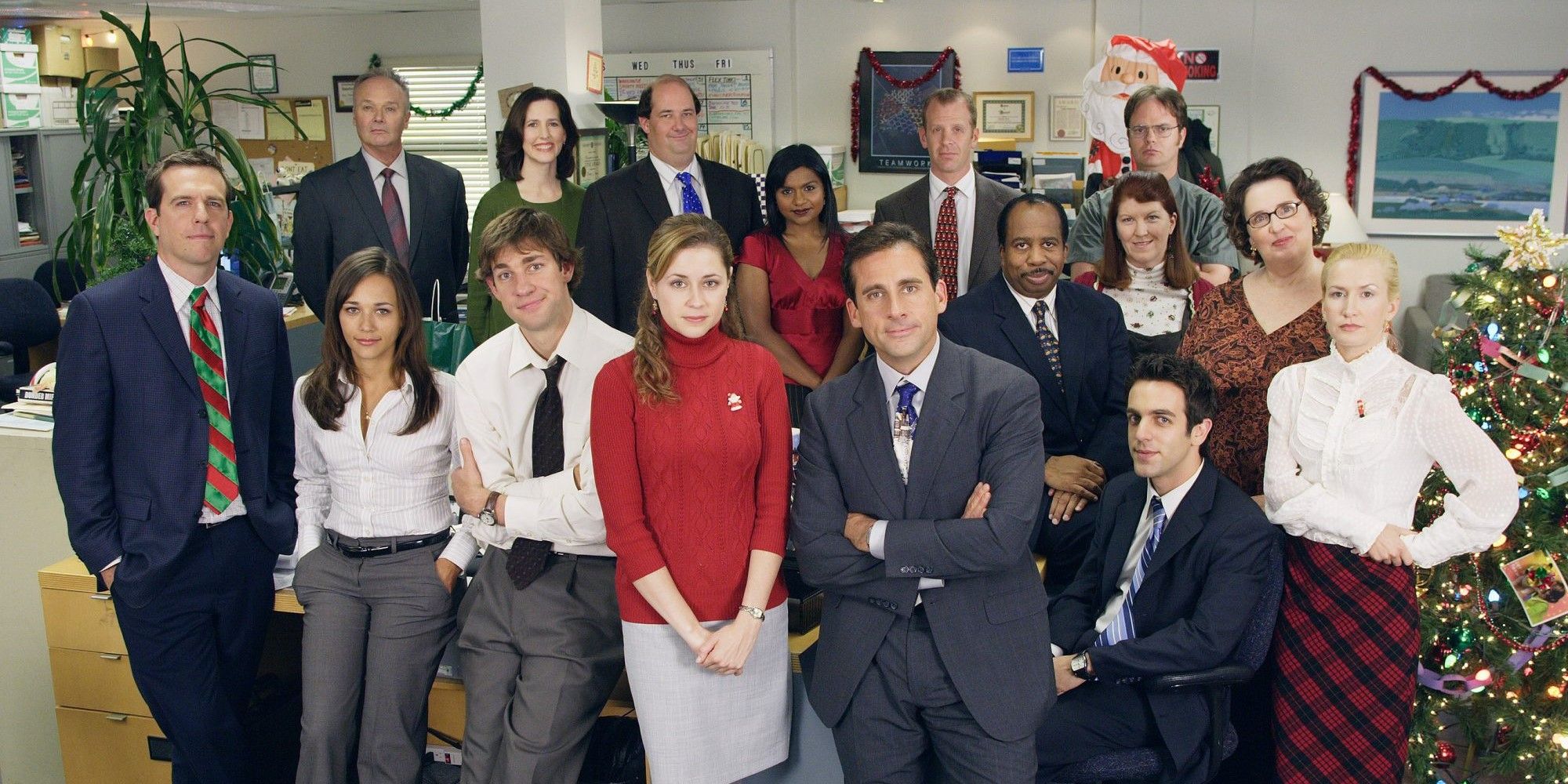 The employees at Dunder-Mifflin pose for a photo