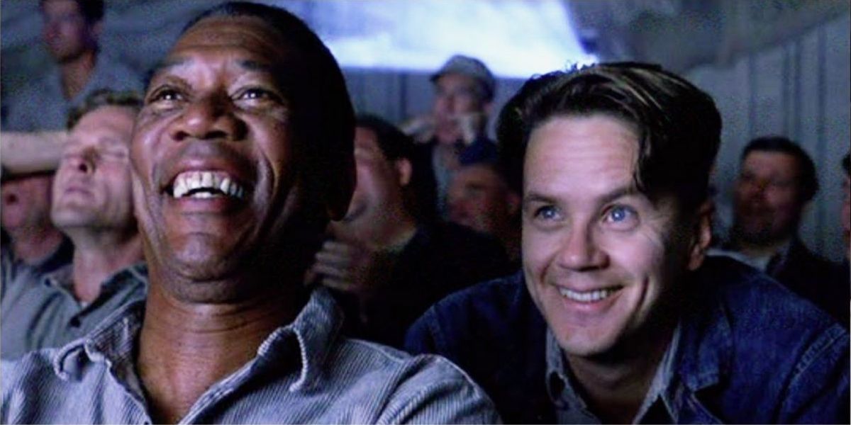 Morgan Freeman and Tim Robbins laughing together in The Shawshank Redemption