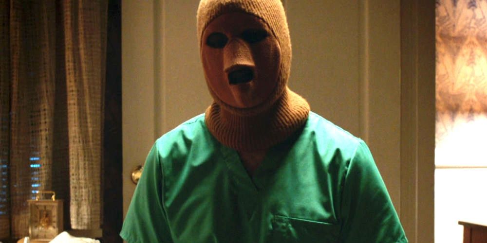 A masked person wearing surgical dress in The Sinner Season 1