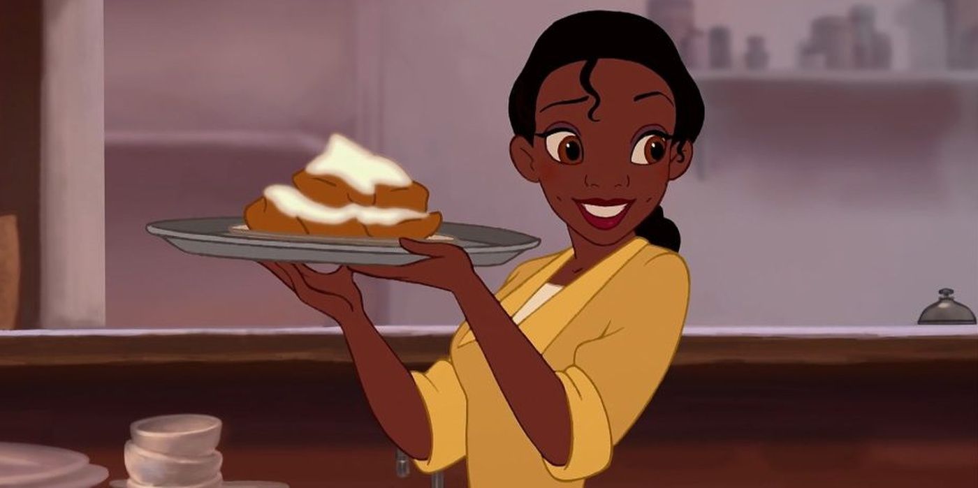 Tiana holding a plate in The Princess and the Frog