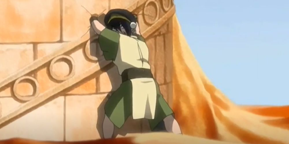 Toph holds up a library.