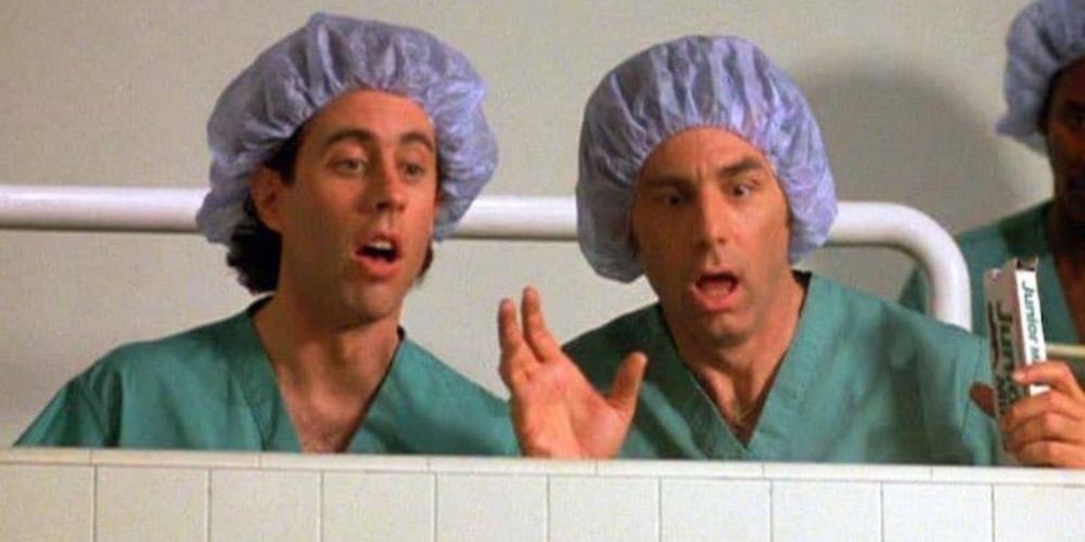 Kramer and Jerry wearing scrubs.