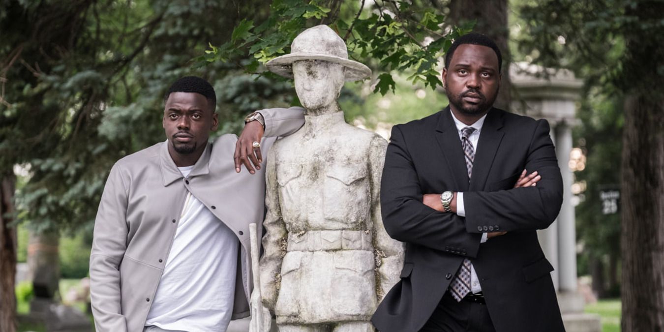 Daniel Kaluuya leans on a statue next to Brian Tyree Henry in Widows