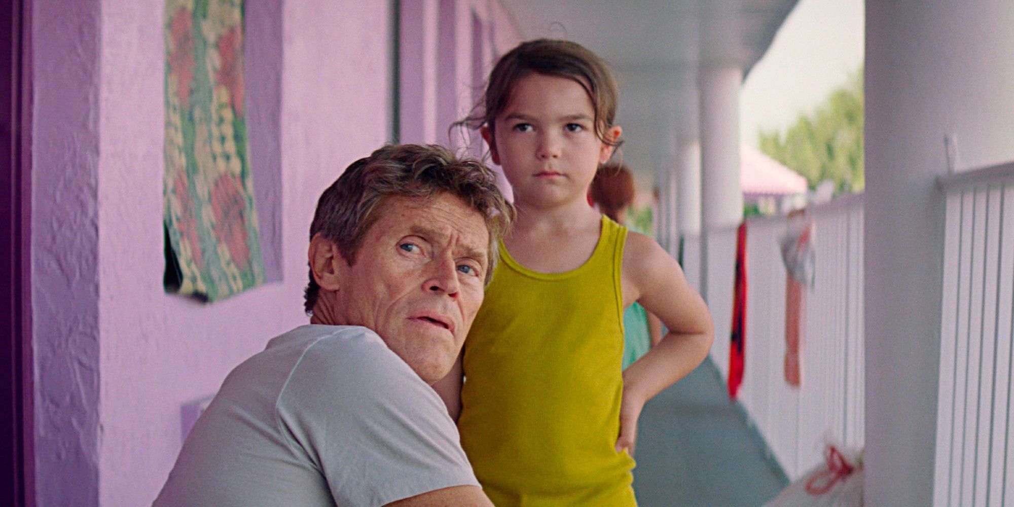 Bobby and Moonee looking in the same direction in The Florida Project
