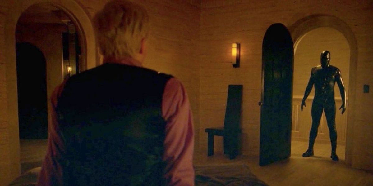 The rubber man stands at Mr. Gallant's doorway in AHS Apocalypse