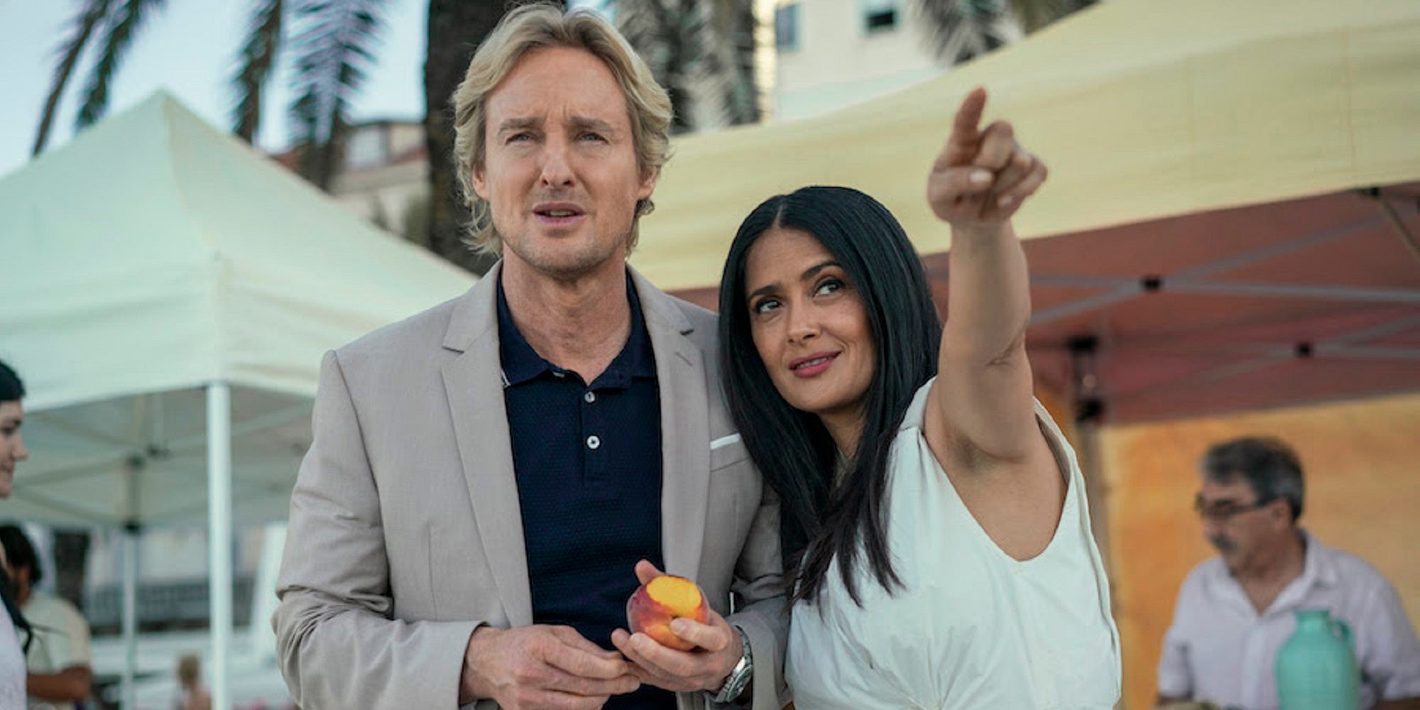 Salma Hayek points something out to Owen Wilson in Bliss