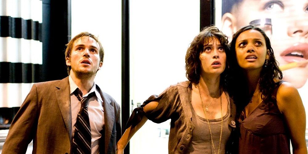 Three characters looking up in Cloverfield