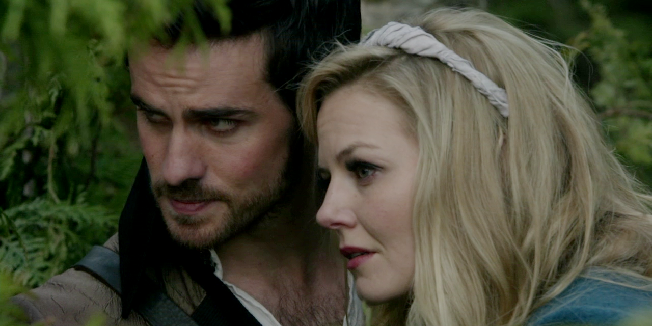 Hook and Emma hiding in the bushes in Once Upon a Time.