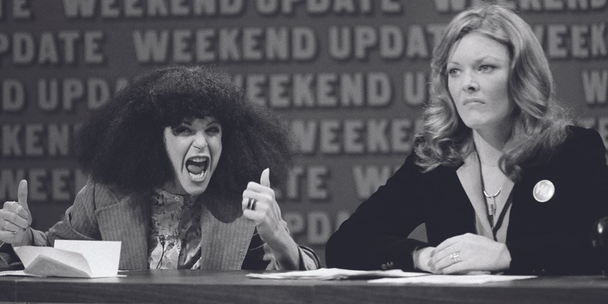 Jane Curtin listens to Gilda Radner during the Weekend Update segment.