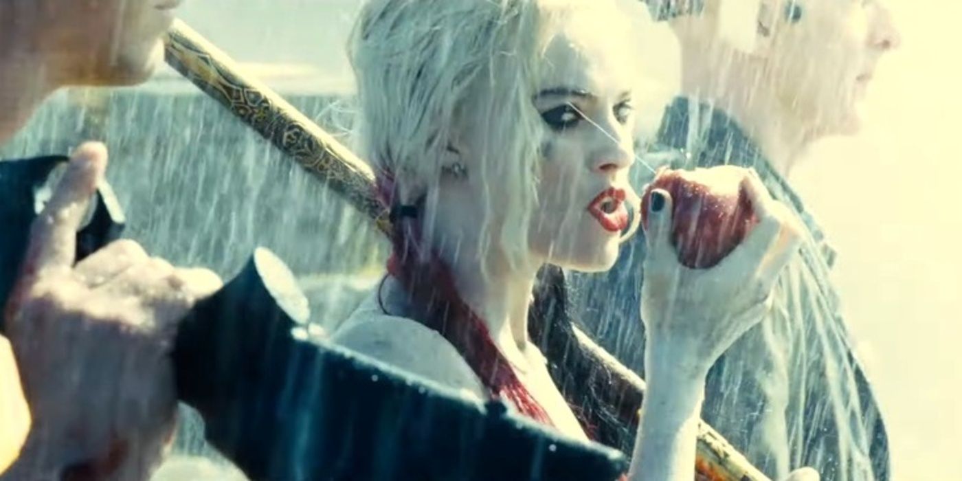 Harley Quinn eats an apple in the rain