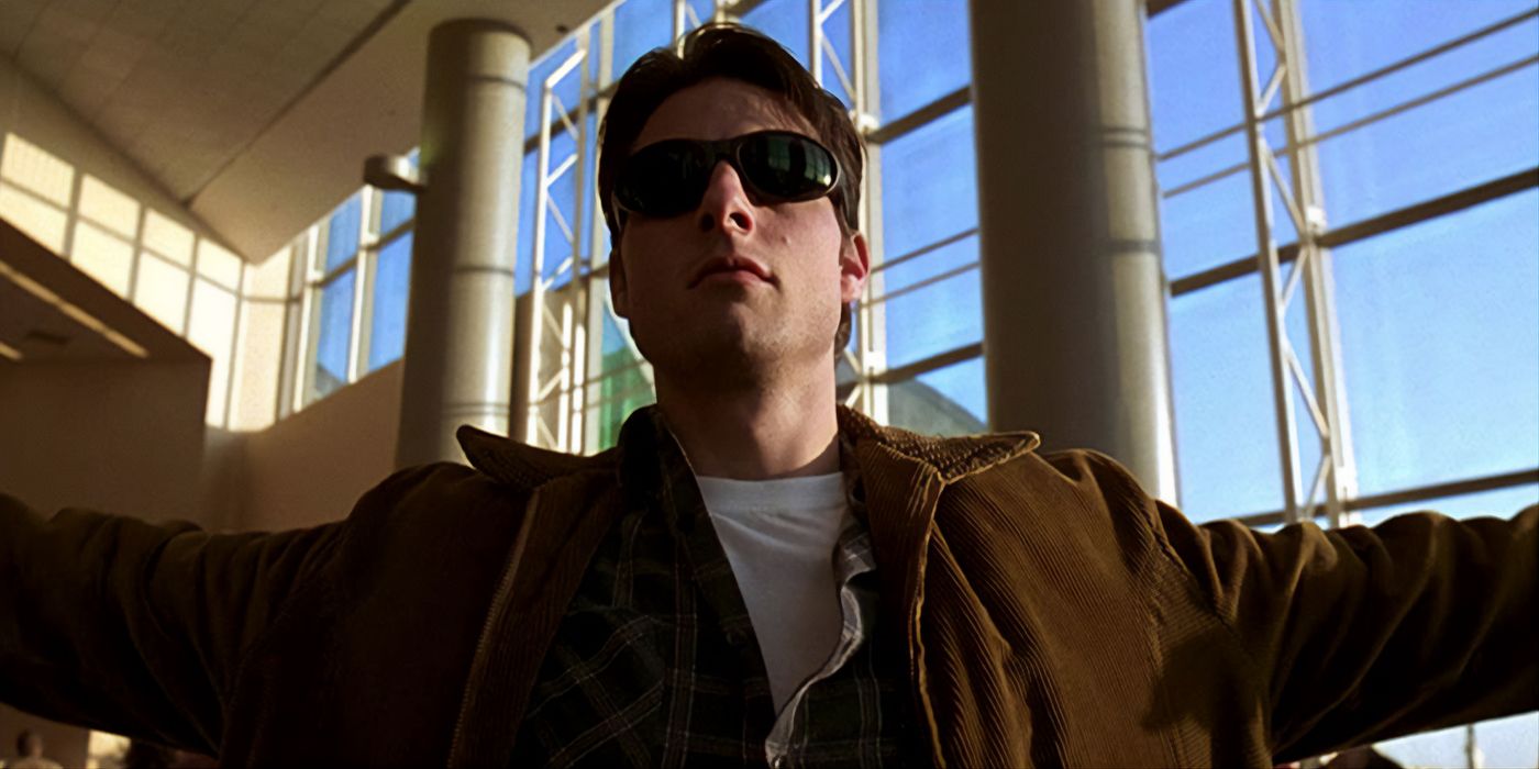 Jerry Maguire with his sunglasses on and arms open