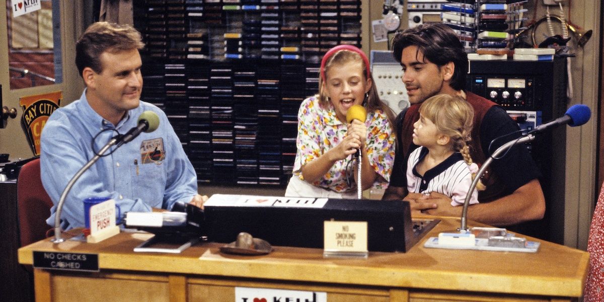 Jesse and Joey working as radio hosts in Full House with Stephanie and Michelle in the studio.
