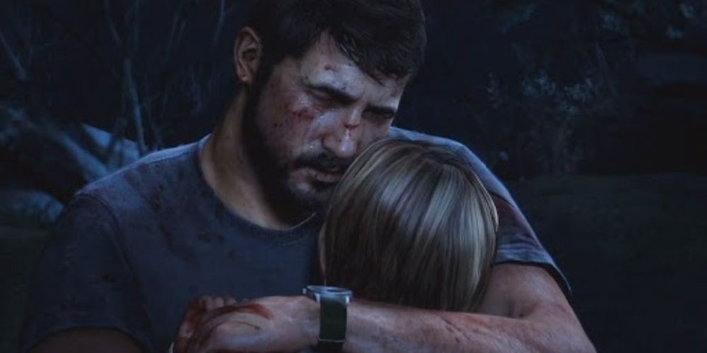 joel cradles his daughter after her death in the last of us