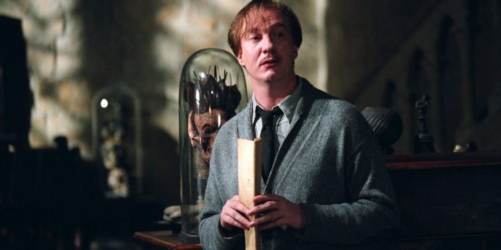Remus Lupin holding a letter in Harry Potter
