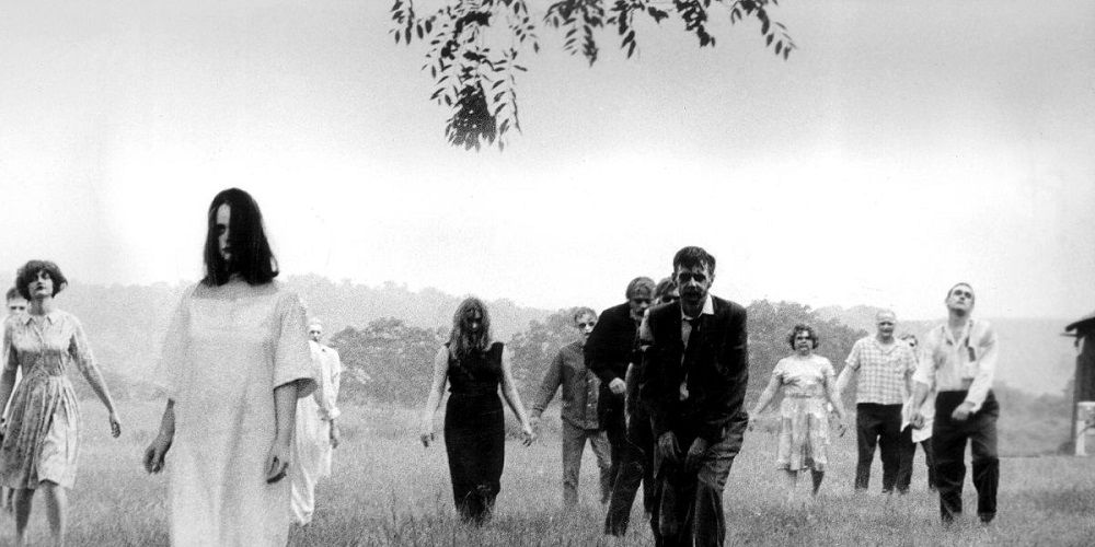 A group of zombies walking in the countryside in Night of the Living Dead